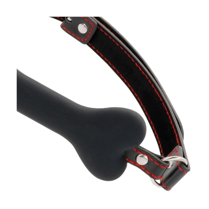 Detalle de la mordaza DARKNESS con forma de hueso y correas ajustables